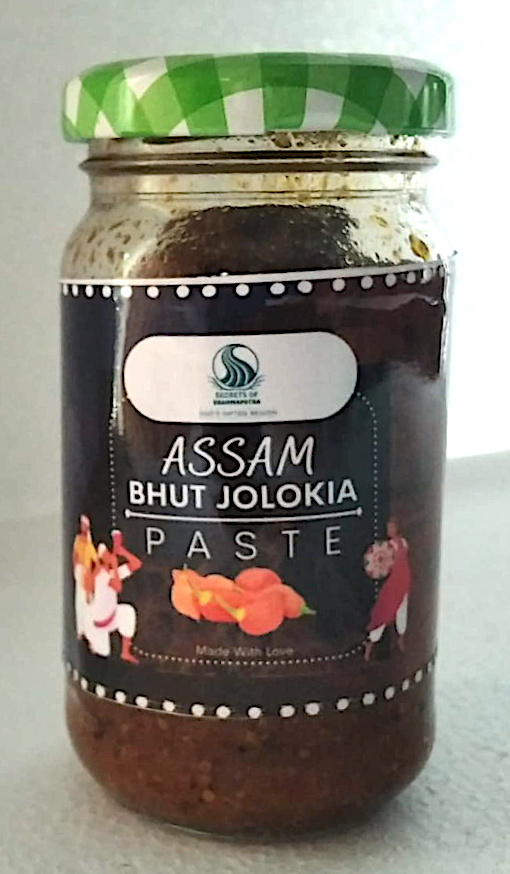 Image of Natural Assam Bhut Jolokia Paste.  Bhut Jolokia acts as a natural painkiller and also improves body metabolism and promotes weight loss.  It saves you from the heat in summer and from cold in winter.  Secrets of Brahmaputra sells products that include organic food, spices, pickles, teas, Bamboo products and natural items that are sourced and manufactured in the North East of India. It is a North East Farms Sales Endeavour. All profits are shared with farmers from the North East of India